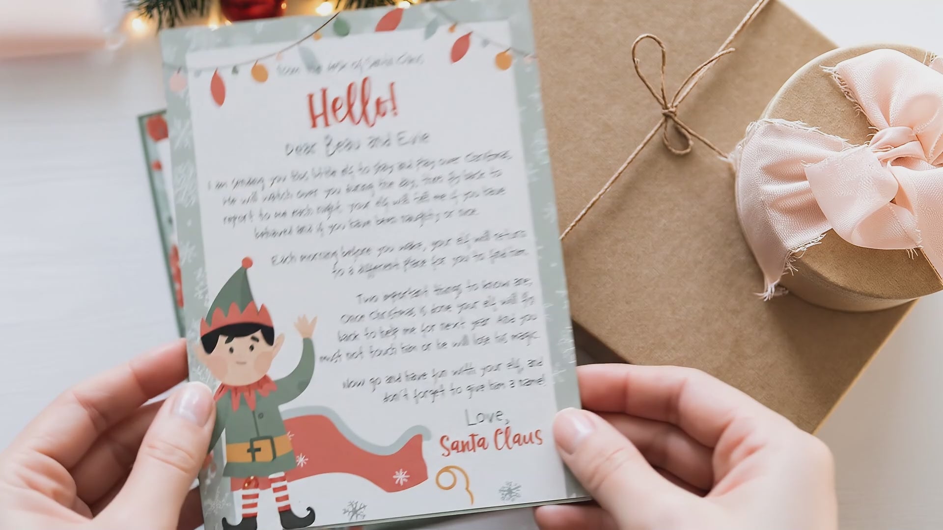 video of hands showing christmas elf printed letter with gifts in background