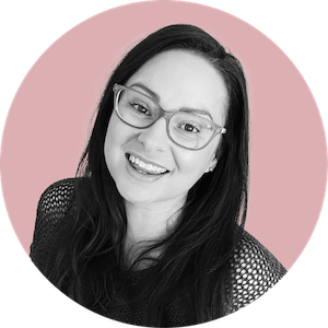 lauren from a visual merriment printables wearing glasses with pink background