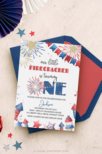 vertical our little firecracker is one 4th of july 1st birthday invitation with blue envelope and party decor