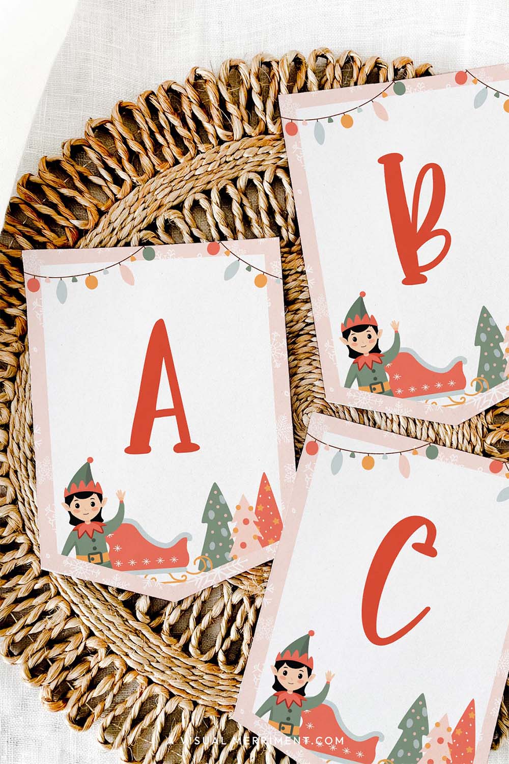 vertical Printed ABC pink elf on the shelf banner sign laying on mat