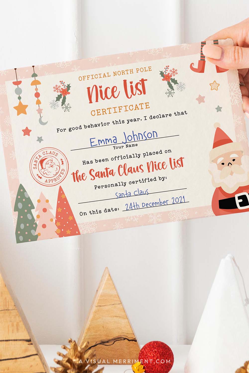 vertical editable girls santa nice list certificate held by hand with tree decor