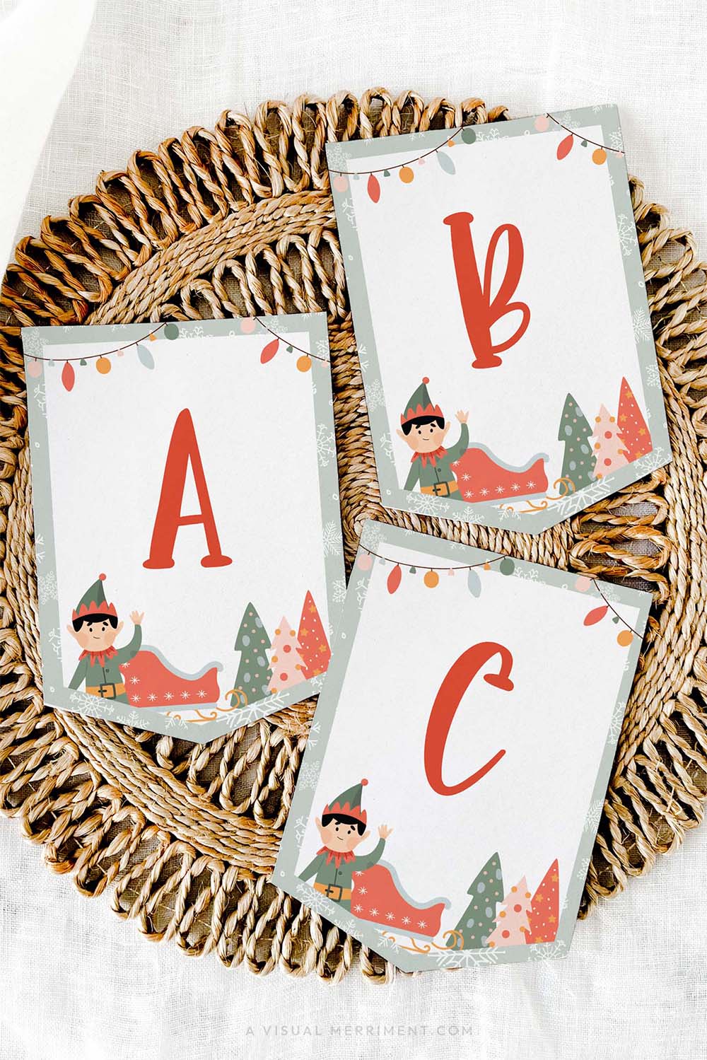 vertical Printed ABC elf on the shelf sign flags laying on mat