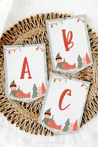vertical Printed ABC elf on the shelf sign flags laying on mat
