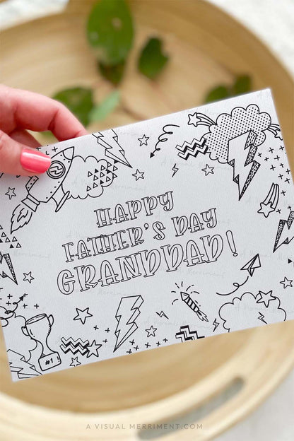 Vertical of Hand holding kids happy father’s day Granddad printable coloring card