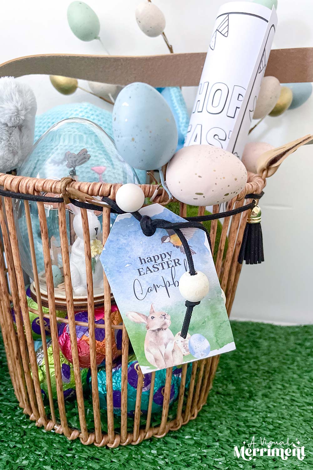 filled easter basket with happy easter gift tag tied to it