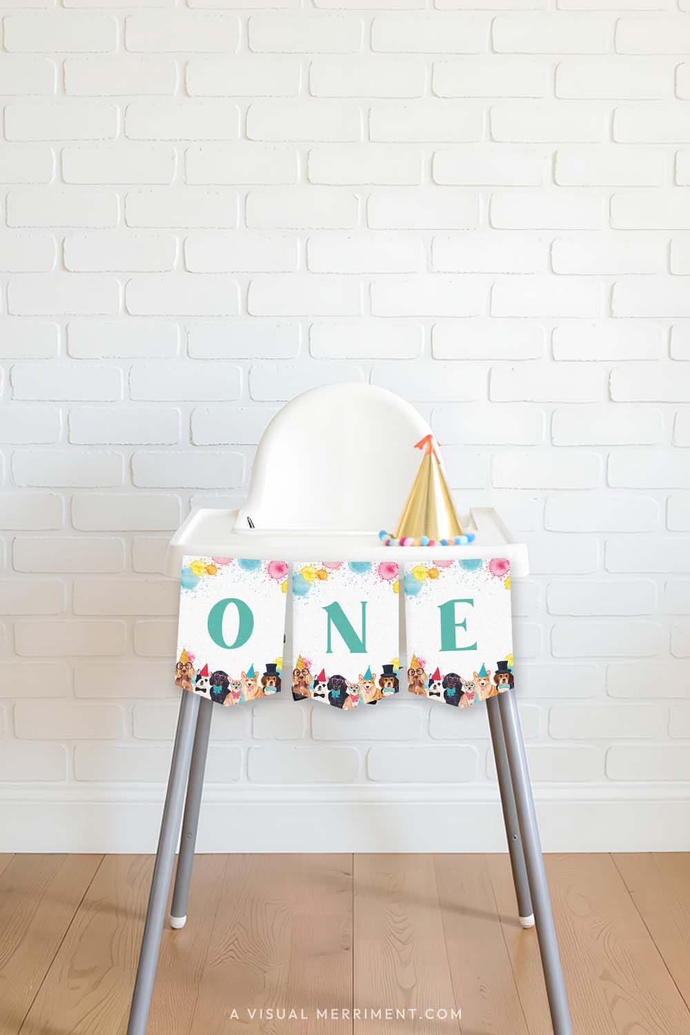 high chair with pawty dogs printed ONE banner flags, party hat against brick wall