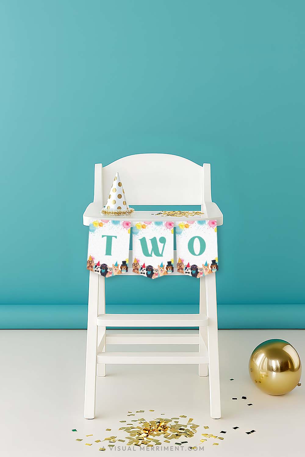 vertical of White high chair with a green 'TWO' printable dog party banner and party hat