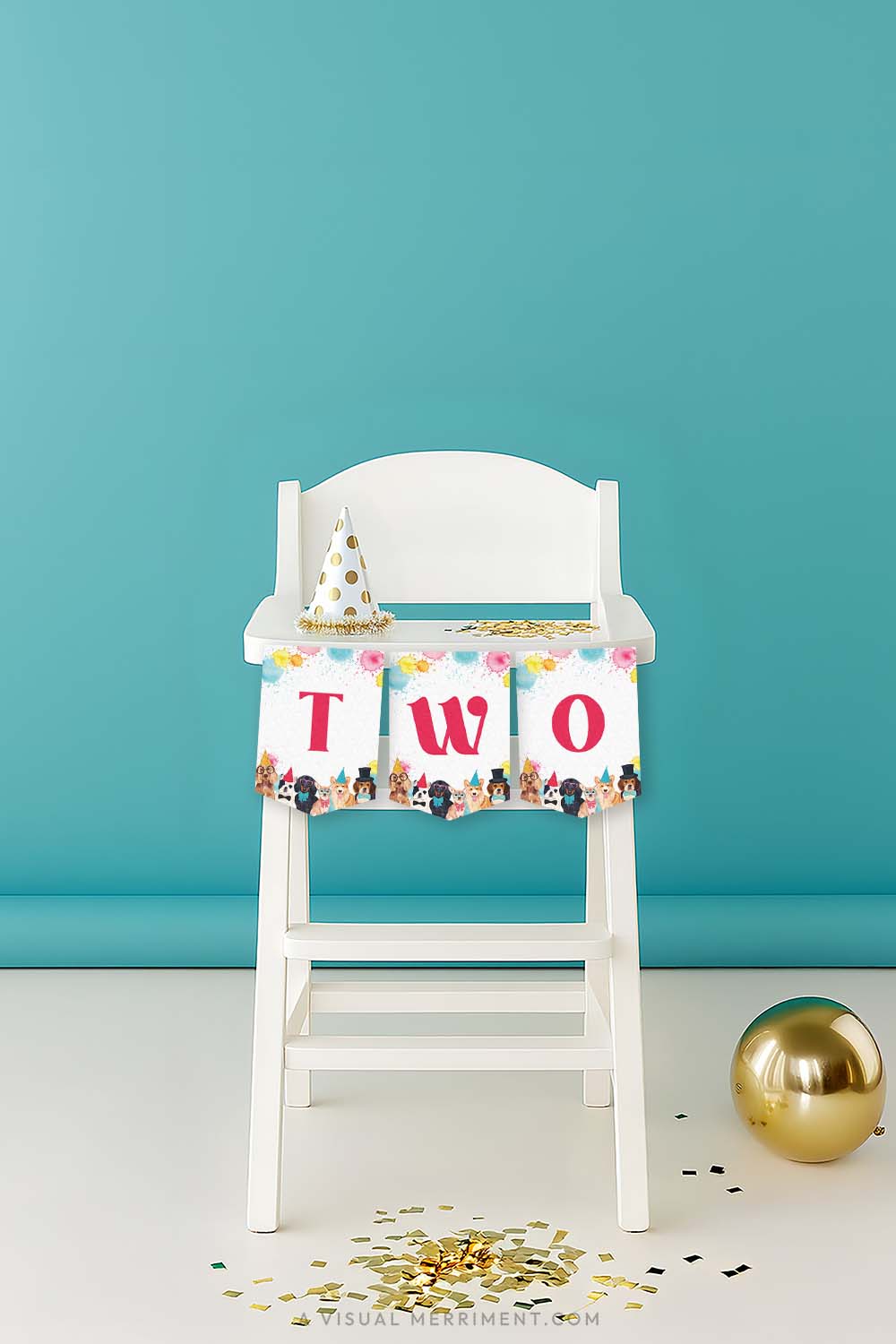 White high chair with a red 'TWO' printable dog party banner and party hat