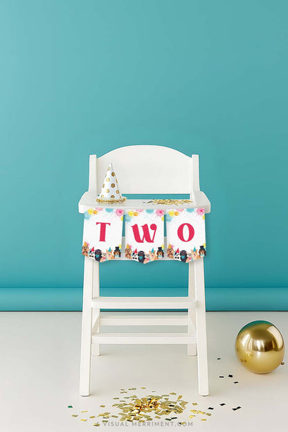 White high chair with a red 'TWO' printable dog party banner and party hat