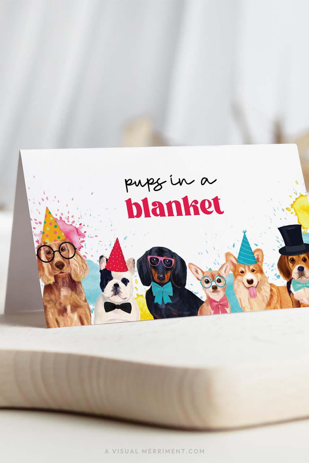 Vertical of party dogs with hats and paint splatters printable place cards template on board