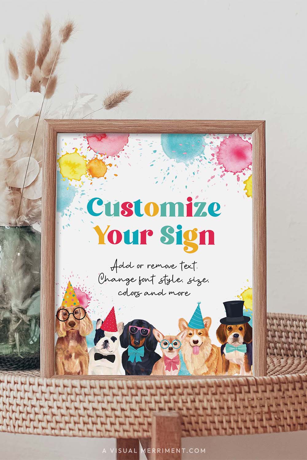 colorful custom dog party sign in a frame sitting on a grass table with a vase of boho stems