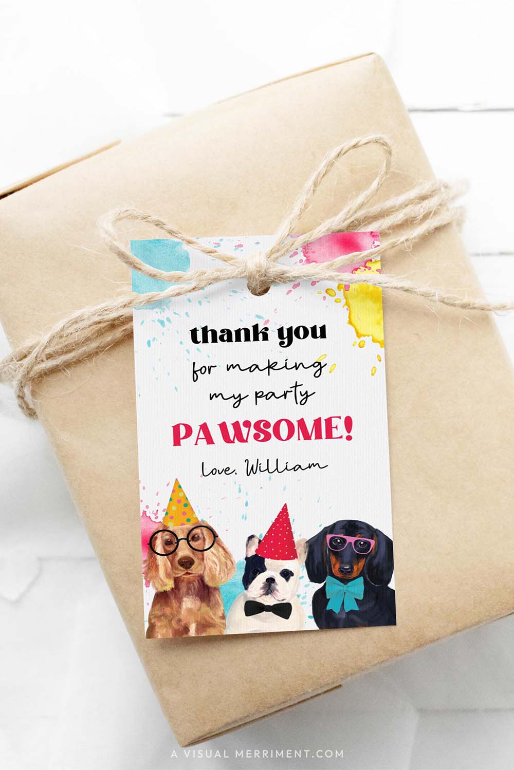 Gift wrapped in brown paper with a colorful 'thank you' tag featuring party dogs and paint splatters