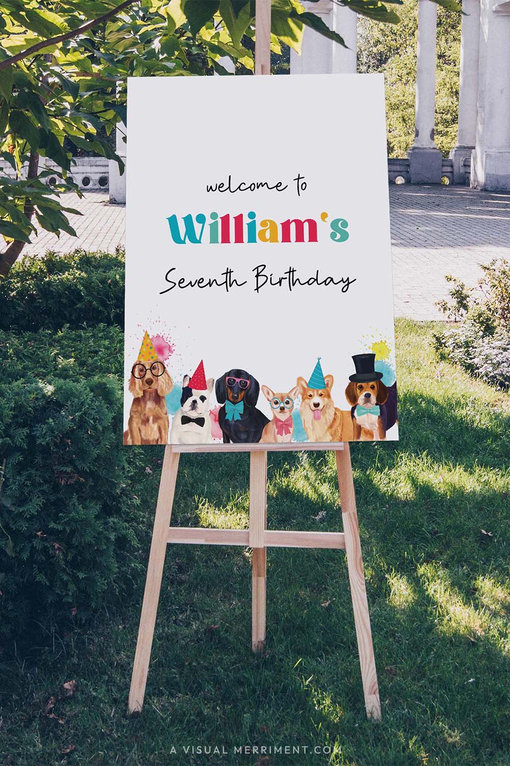 Vertical Large custom welcome sign with party dogs wearing party hats on an easel outdoors.