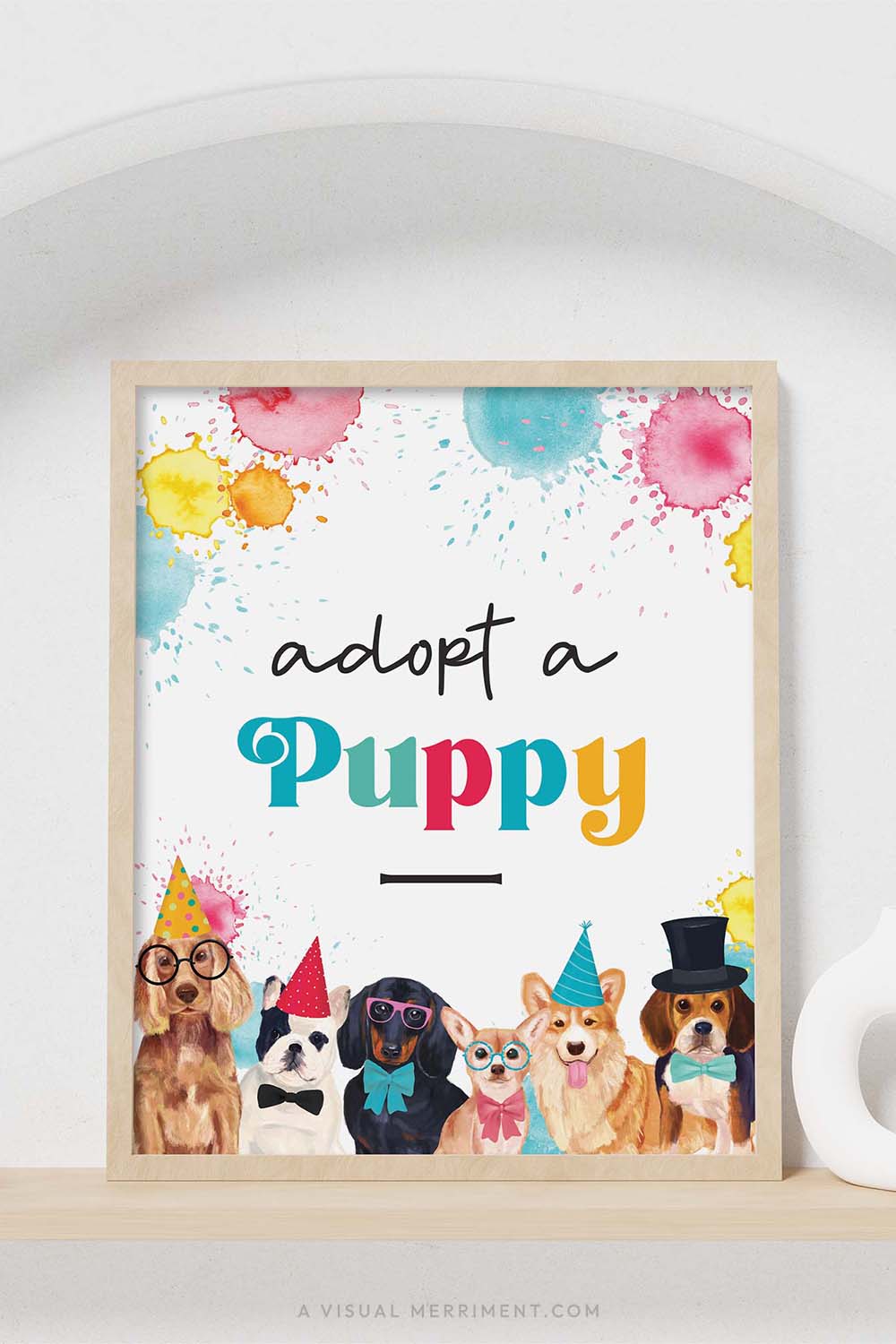 colorful adopt a puppy party dogs sign with in a frame sitting on a shelf