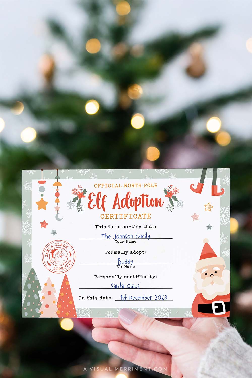vertical hand holding elf on the shelf adoption certificate paper