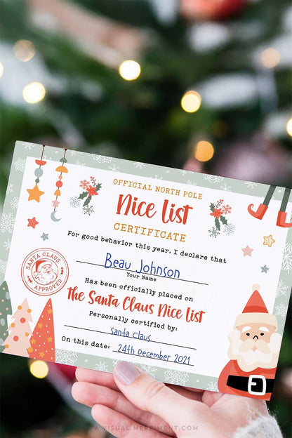 vertical editable santa nice list certificate held by hand in front of christmas tree