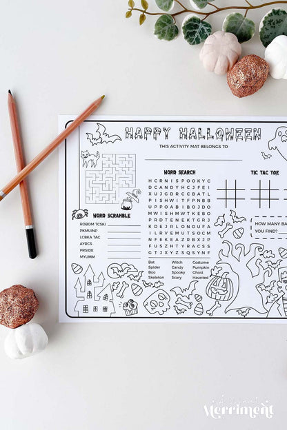 vertical of coloring printable halloween activity sheet with pencils and halloween decor elements