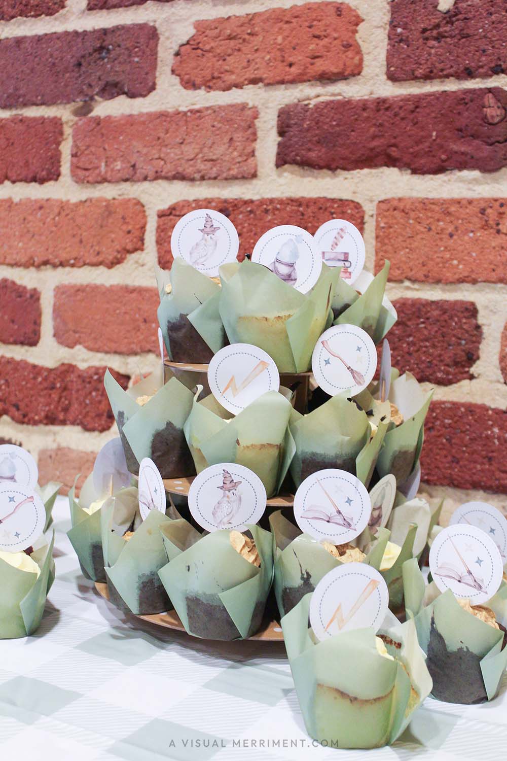 cupcakes on tiered stand with harry potter inspired printable cupcake toppers with magic elements