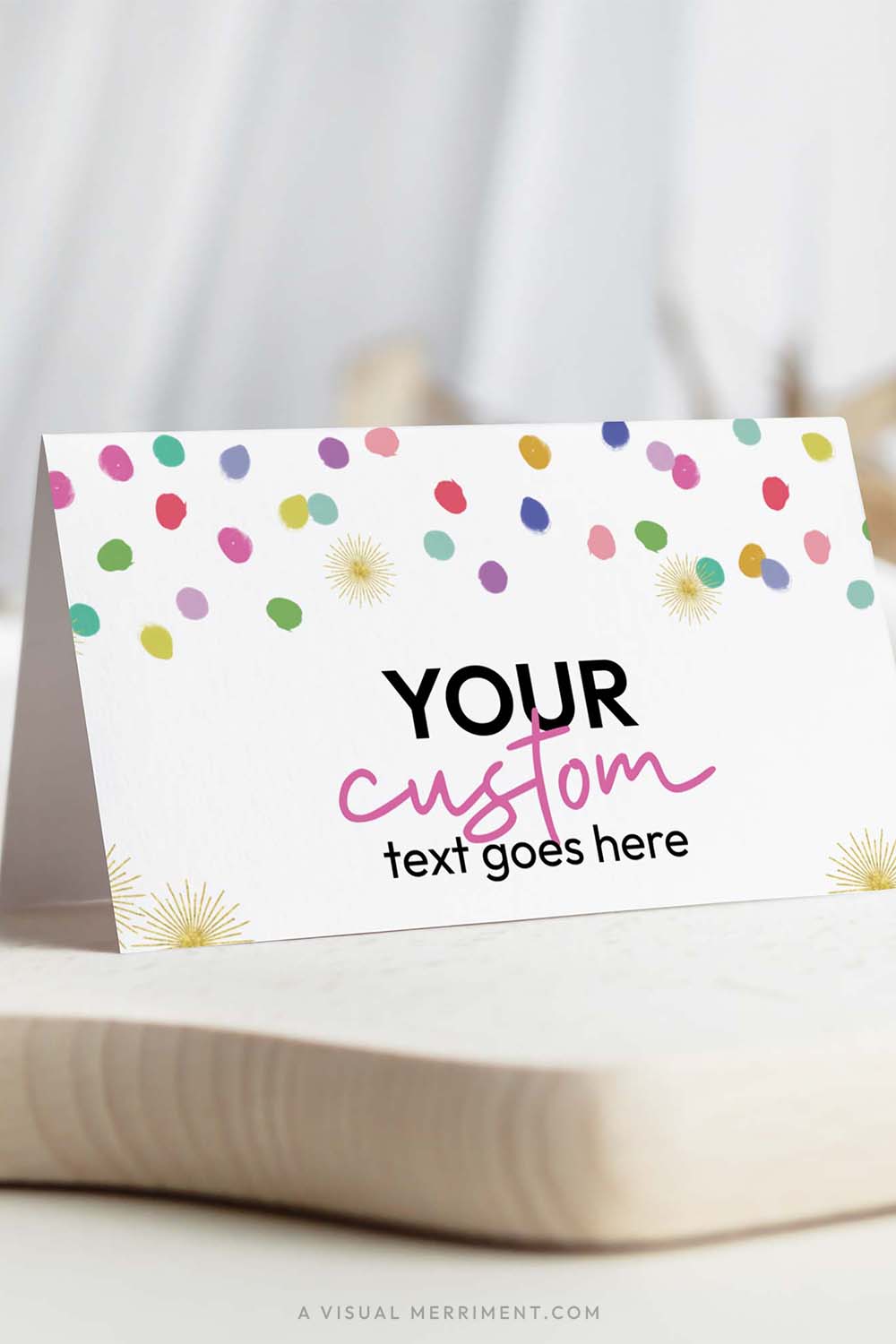 Vertical of colorful polka dot rainbow confetti printable place cards template on board