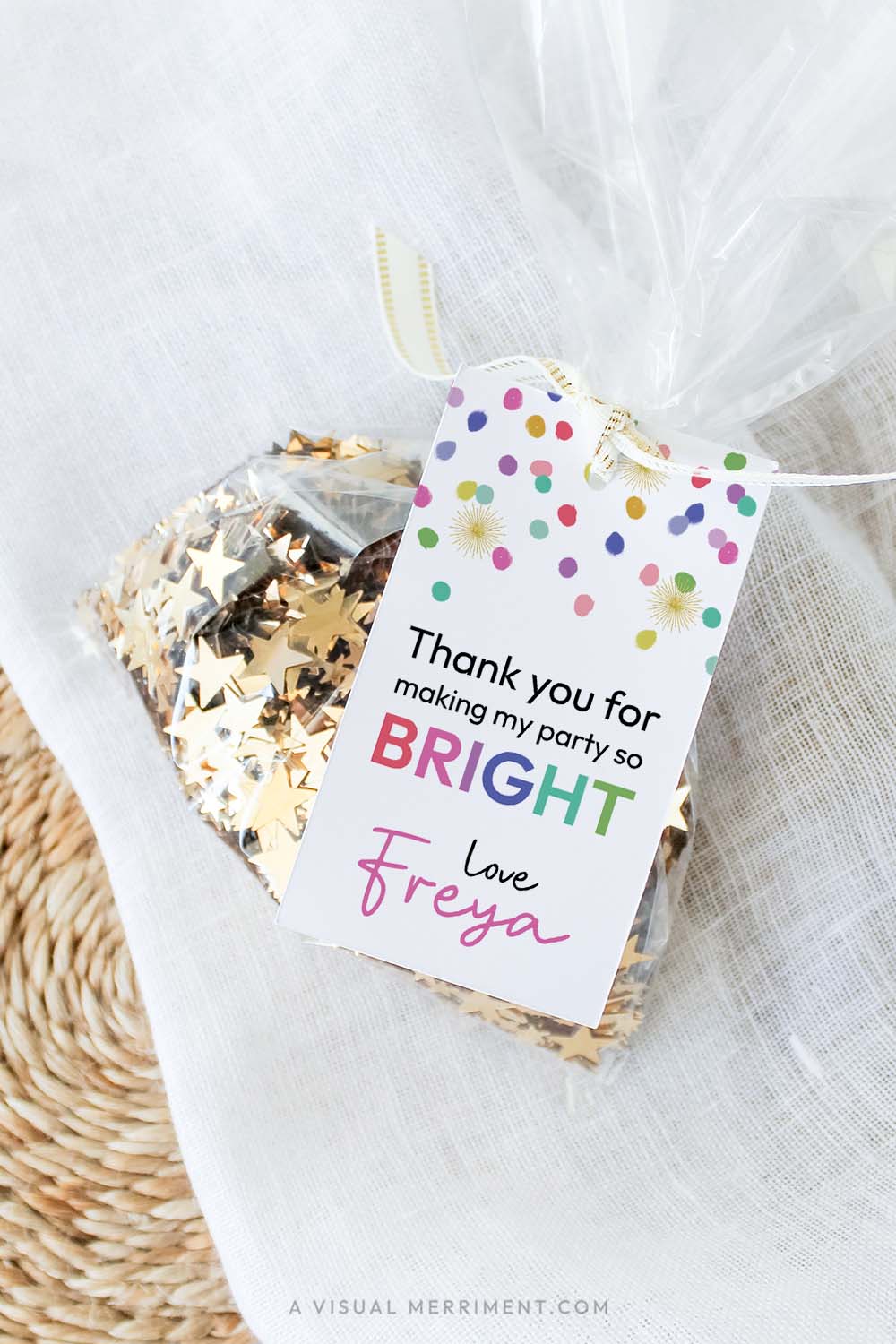 colorful rainbow confetti printable gift tag template with polka dots attached to bag of sequins