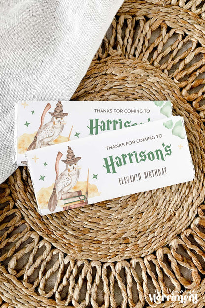 2 printable chocolate wrappers on mat with owl design for harry potter style birthday