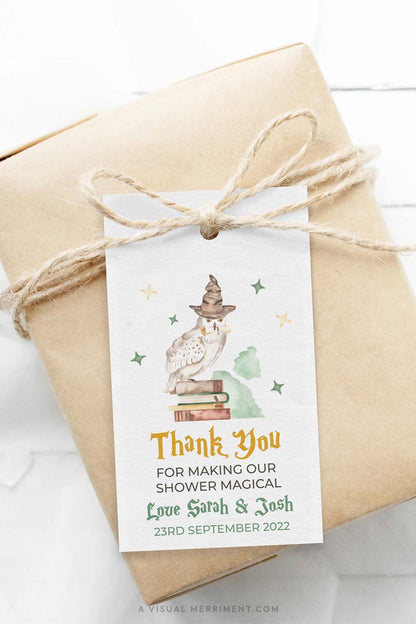 Gift wrapped in brown paper with baby shower printable gift tag with owl and books design in a harry potter style