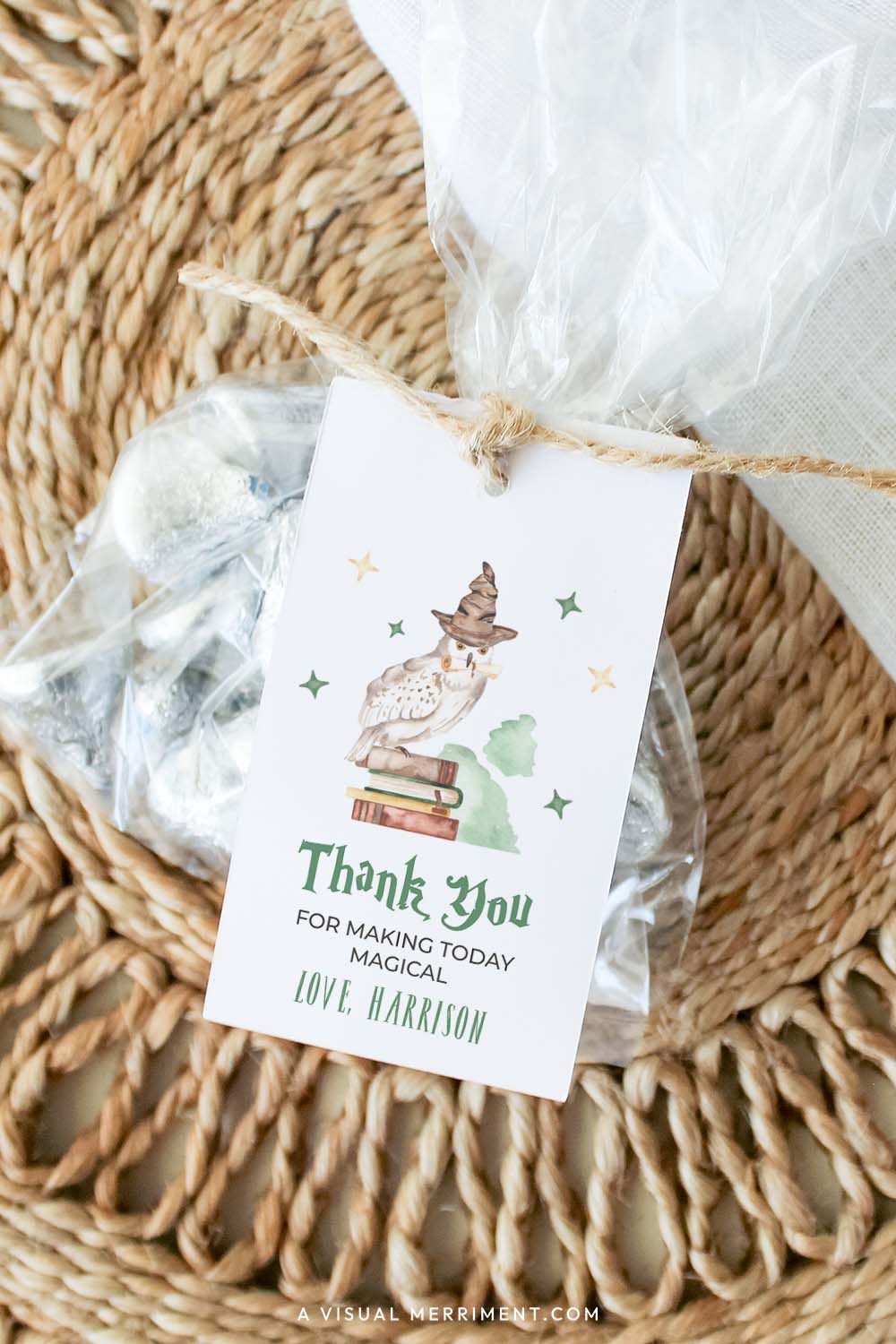 Harry potter style thank you editable gift tag template with wizard school elements attached to bag of treats