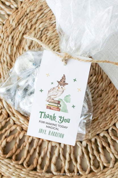 Harry potter style thank you editable gift tag template with wizard school elements attached to bag of treats